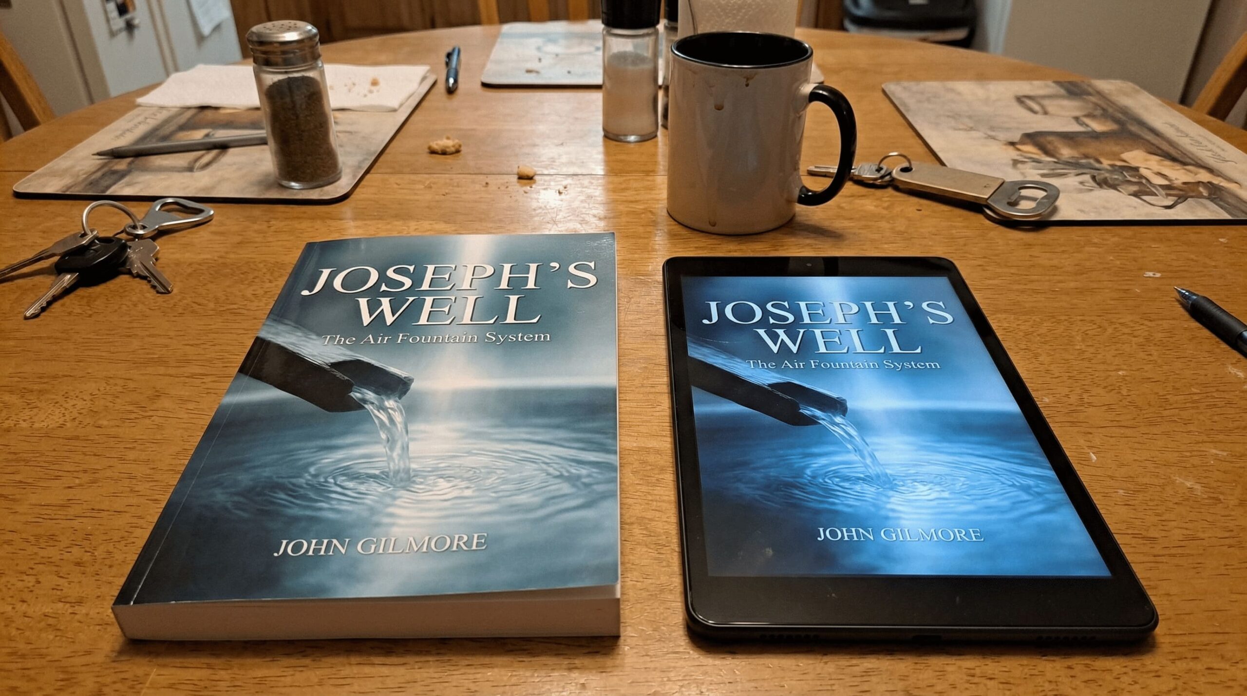 Joseph's Well physical book and digital guide on a table