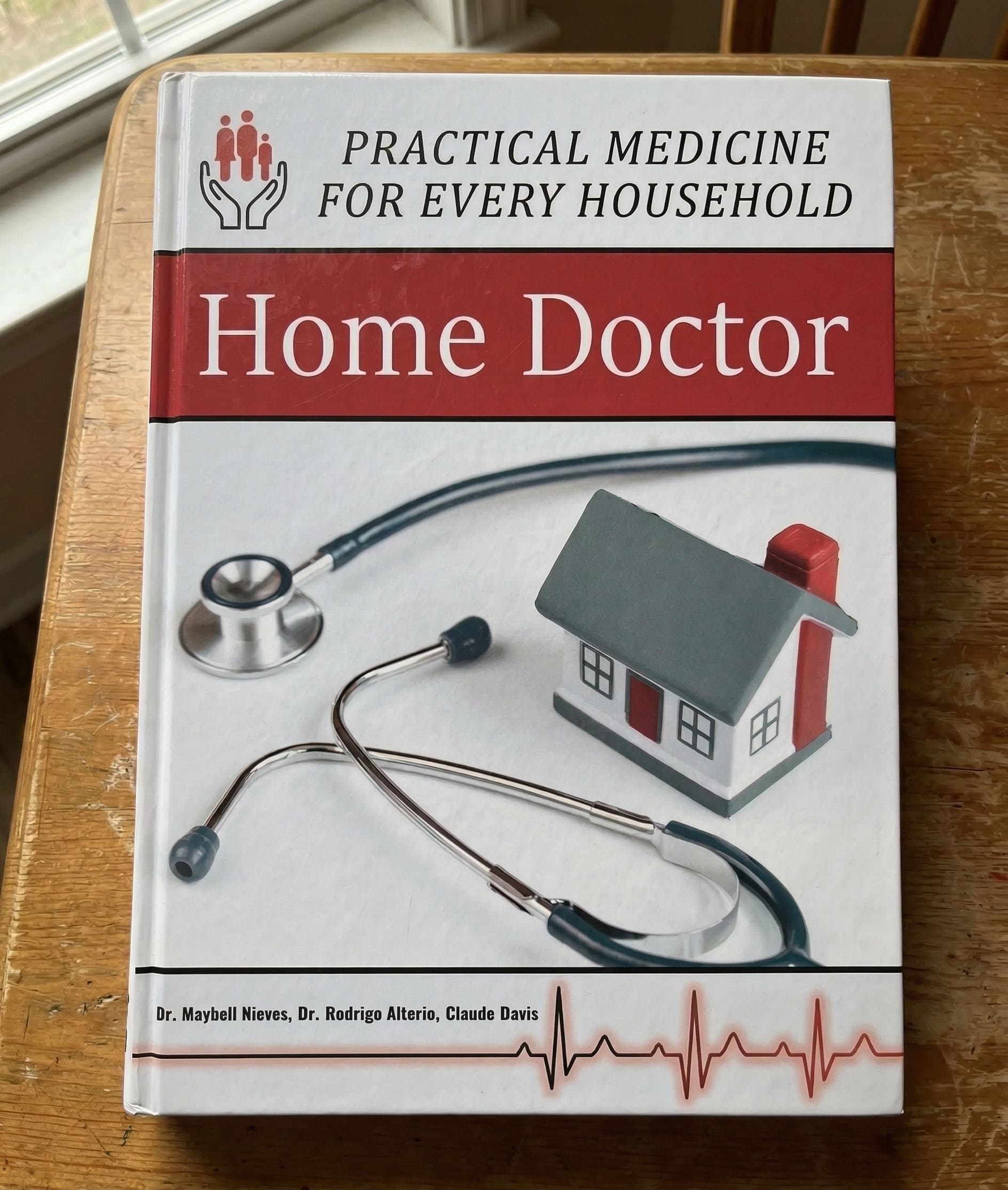 The Home Doctor physical book with medical supplies
